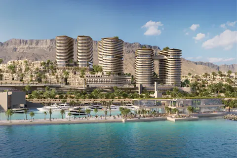 Daytime rendering of the towers rising above the marina promenade and moored yachts